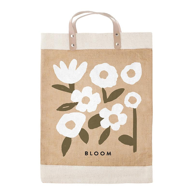 Beige tote bag with white floral design and 'BLOOM' text on a white background